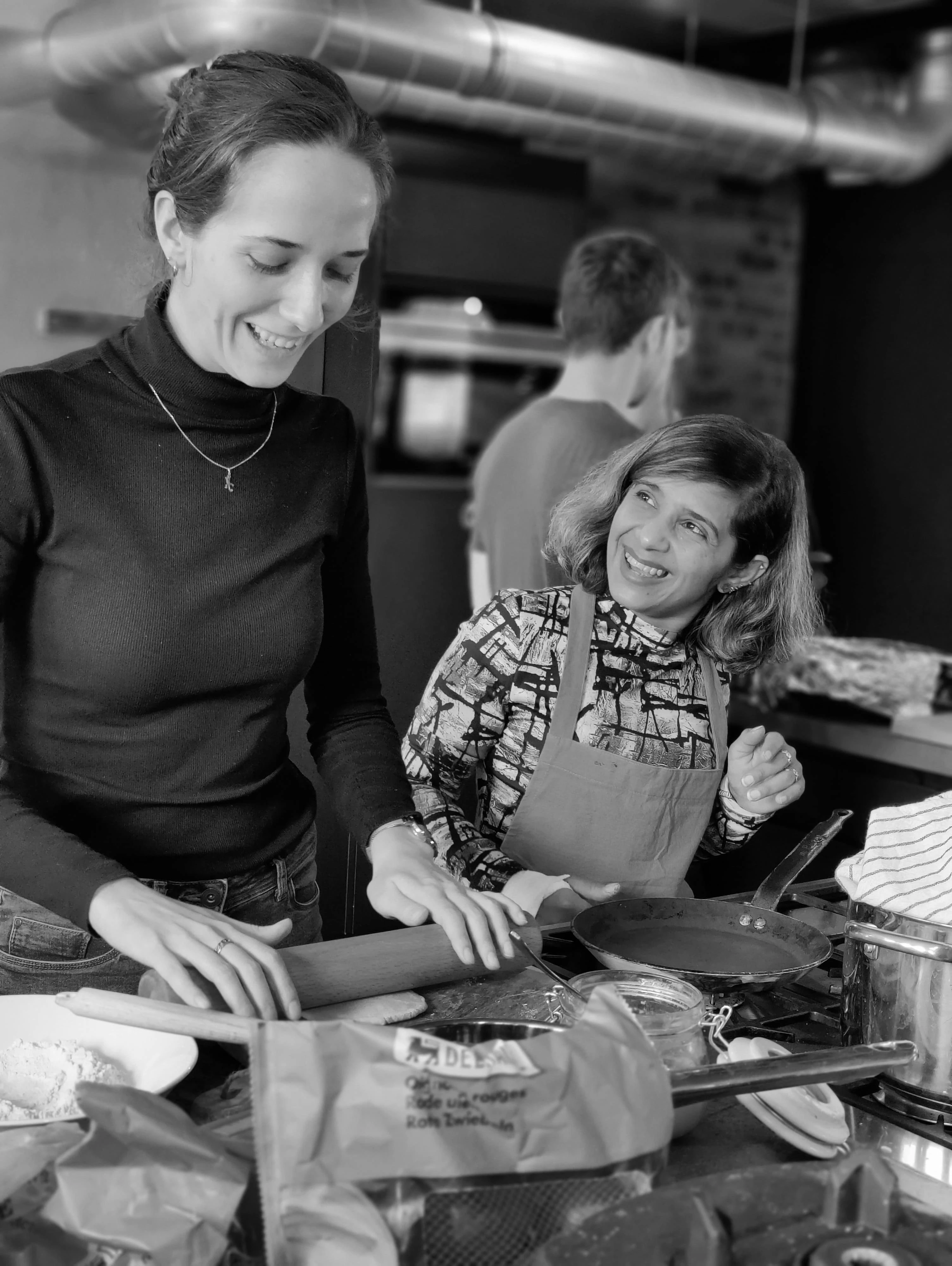 Hands-on guidance from the chef during the workshop.